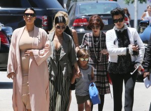 51809114 The 'Keeping Up With The Kardashians' clan are spotted at the Pantages Theatre in Hollywood, California to watch 'The Phantom of the Opera' on July 26, 2015. Kim, who is currently pregnant with her second child, hid her growing baby bump under a tight beige dress. FameFlynet, Inc - Beverly Hills, CA, USA - +1 (818) 307-4813